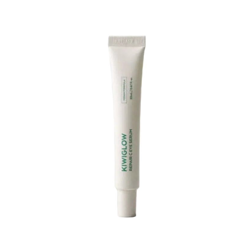 KIWIGLOW 純素修復維C眼精華 20mlA white squeeze tube of Kiwiglow Repair Eyes Serum with green text, standing upright against a light gray background.